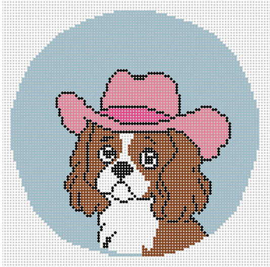 Needlepoint design of a "Cavalier" breed in a Pink Cowboy hat on light blue 18 mesh